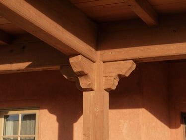 Close-up of restored historic Cottonwood home framing, showing clean joints and structural wood trim under warm natural window light.