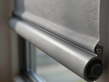 Extreme close-up of a Mirage cellular shade mechanism and fabric edge, cool north daylight revealing the honeycomb texture, grey aluminium rail in sharp focus, shallow depth of field, luxury residential context