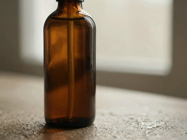 Close-up of a dark glass bottle of grooming oil on a wet stone surface, soft directional light, 35mm
