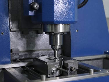Triple-station CNC busbar machine, close-up of punching head, industrial machinery photography, crisp lighting, 50mm
