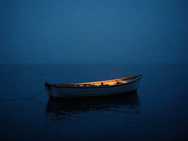 Anamorphic wide shot of a small wooden boat on a dark, misty northern sea at dawn, cold blue tones with a single warm amber light
