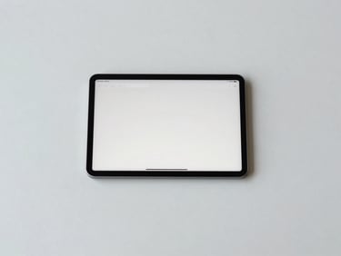 Overhead shot of a minimalist desk with a tablet displaying a clean interface, soft natural light, structured layout, 35mm