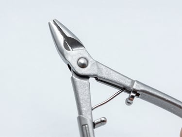 Close-up of an orthopedic bone rongeur, highlighting its robust construction and sharp cutting edges, cool studio lighting, sterile white background.