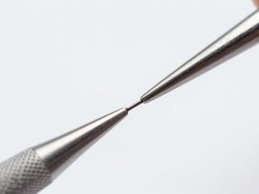 Macro shot of a dental explorer tip, showing its fine point and polished surface, cool studio lighting, sterile white background.