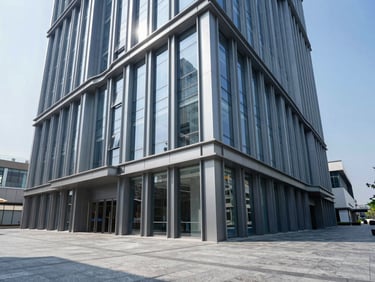 Wide architectural angle of a modern commercial lobby with structural steel frames and high-end finishes, crisp daylight, cool slate tones, 35mm.