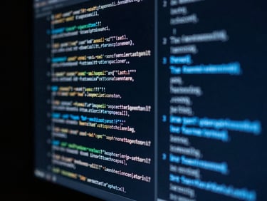 Macro close-up of a high-end monitor displaying glowing silver and blue code, dark studio background, shallow depth of field, 35mm