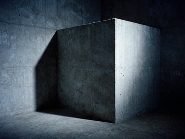 A high-contrast 16mm film still showing a desolate concrete reverb chamber, harsh shadows, cold blue lighting, visible film grain