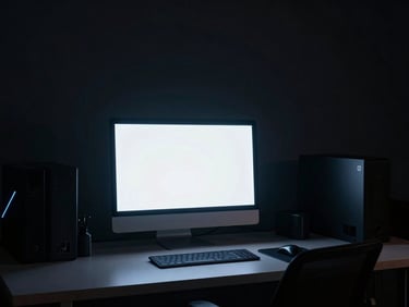 Moody architectural studio shot of a creative workspace with a glowing monitor, dramatic key lighting, high-contrast shadows.