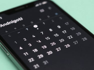 Macro shot of a high-fidelity Android device displaying a clean, dark-mode calendar interface, soft mint green accents, cool ambient glow.