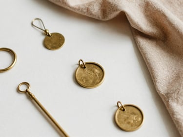 Minimalist flat-lay of curated brass and raw silk keepsakes, soft diffused natural lighting.