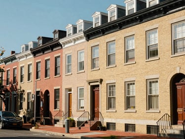 Street view of a vibrant Philadelphia neighborhood with historic architecture, natural daylight, sharp focus, 35mm lens.