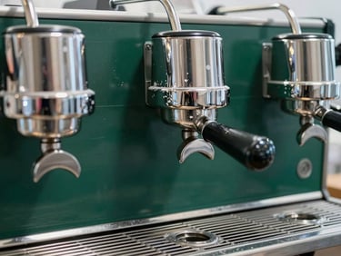 Commercial coffee machine group head with visible white scale deposits, crisp technical lighting, deep green and metallic tones, sharp focus, 35mm lens