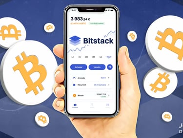 a person holding a phone with bitcoin on it
