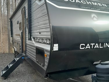 Temporary RV housing unit delivered to homeowner property during insurance repairs