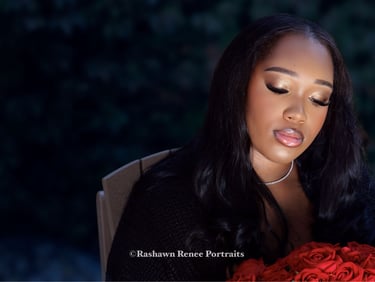 a woman with a bouquet of roses in her hand Senior Portraits