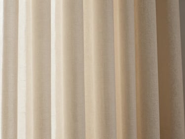 Extreme close-up of heavyweight curtain fabric weave — silk-blend fabric with a subtle geometric texture, soft north-facing daylight revealing thread structure and a warm ivory tone, flat-lay framing
