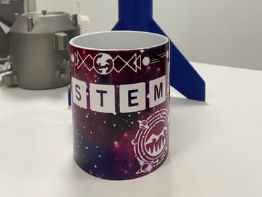 Designed and hand‑made sublimation‑printed “STEMinist” mug.