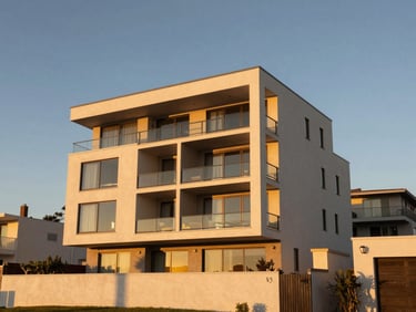 Modern coastal duplex building, clean lines, warm Southern California golden-hour light