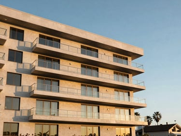 Modern multi-family apartment building exterior with sleek balconies in Redondo Beach, clean daylight