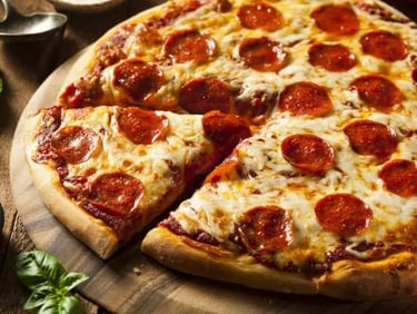 a pizza with a slice missing from the pizza