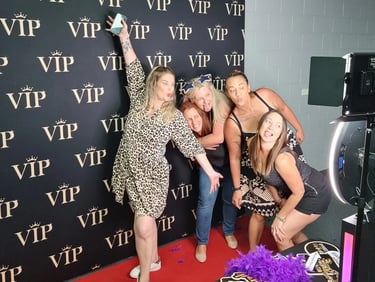 SweetAz Co photo booth setup at a real event in Brisbane, showing a clean, modern display and guests enjoying the experience.