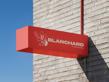 a red sign that says blanchard on it