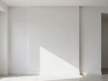 Architectural shot of a modern living room featuring a striking decorative accent wall, sharp lines and subtle texture, bathed in coastal light.