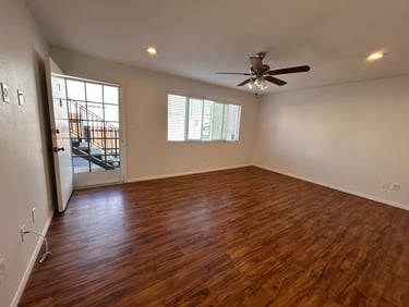 	Bright living room with hardwood floors and recessed lighting