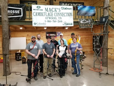Group of individuals trained as archery instructors by Joella Bates. 