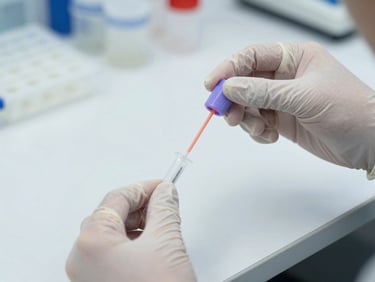 Gloved hands inserting a sample swab into a PCR collection tube on a clean white lab bench, clinical bright lighting, sterile environment, sharp focus on the tube