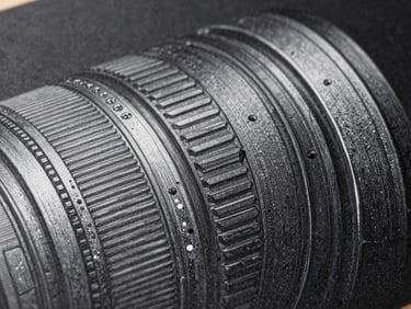 Full-frame digital illustration detail on a dark ground, fine ink-like linework visible at close range, studio daylight raking across the printed surface to reveal texture depth