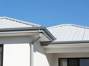 Clean gutters and a pristine roofline of a modern Perth home against a clear blue sky