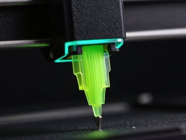 Extreme macro detail of a 3D printer nozzle extruding glowing neon green filament, dark industrial background, cyan rim lighting, 85mm lens