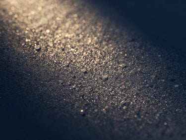 Macro photography of natural enamel textures under soft diffused side-lighting, showcasing micro-details and natural light reflection.