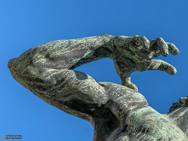 Close-up of the archer’s releasing hand, capturing a sense of strength, tension, and vigor.