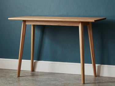 Studio shot of a modern wooden console table with sleek legs, natural daylight, elegant carpentry, architectural interior style