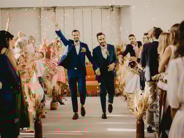 Gay couple just married walking down the aisle — editorial wedding photographer South of France