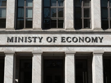 Architectural detail of the Ministry of Economy facade, high-contrast shadows, cool daylight, desaturated corporate tones