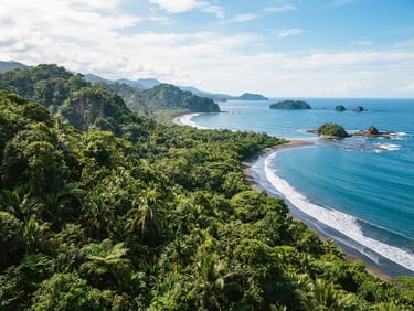 Wide panoramic shot of lush green rainforest canopy meeting the ocean in Bahia Ballena, bright natural tropical sunlight filtering through leaves, 35mm film feel