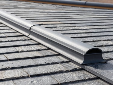 Crisp architectural detail of a continuous ridge vent installation on a modern slate gray roof, sharp focus, clean lines, daylight