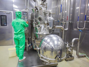 Male operation green protective clothes process in a food factory the processing production line in 