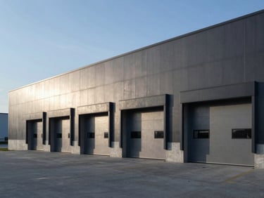 Sleek concrete loading docks and clean architectural lines of a modern distribution center, cool daylight shadow play