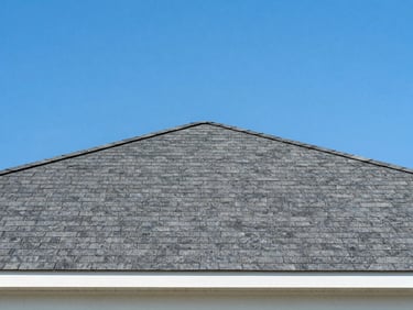 New asphalt shingle roof on a modern Huntsville home, bright daylight, crisp lines, blue sky