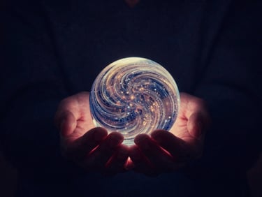 Hands gently cupped, holding a luminous, swirling orb of light, dark background with subtle starlight, soft glow, deep indigo and hints of gold.