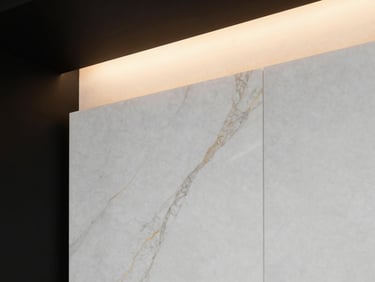Close-up of luxury white marble alternative paneling with golden veins, warm architectural lighting, sharp focus.