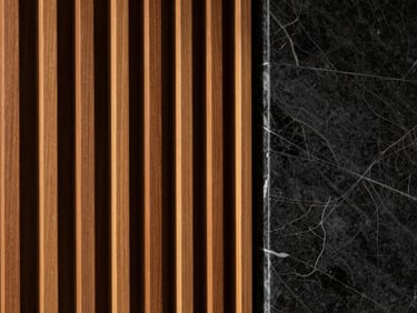 Close-up of a seamless transition between architectural wood slats and a polished marble wall panel, dramatic side-lighting highlighting the rich grain and glossy stone texture, ultra-clean craftsmanship, sharp focus.