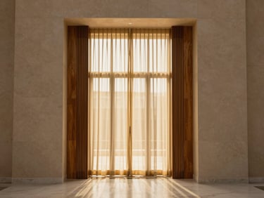 Architectural straight-on shot of a modern Saudi Majlis, warm golden light filtering through sheer curtains, showcasing smooth neutral painted walls and elegant wood cladding transitions.