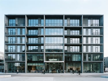 Straight-on architectural view of a modern concrete and glass office building, sharp lines, cool daylight, slate tones.