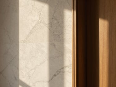 Close-up of high-quality marble and wood architectural textures in a renovated Barcelona home, soft daylight, 35mm