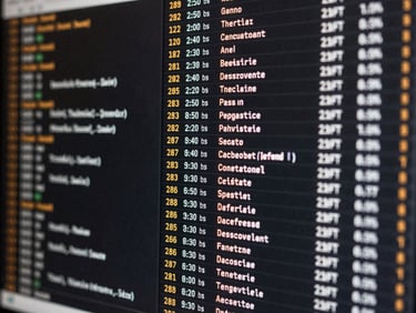 Close-up of a high-density digital screen showing raw text feeds and timestamps, amber highlights, sharp focus on monochromatic data, clean technical interface